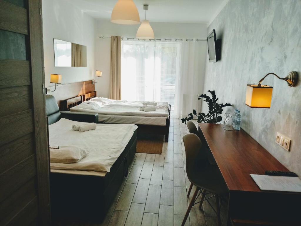 Voodi või voodid majutusasutuse Hotel Miłosz Restauracja, Basen dla dzieci, Sala Zabaw, Siłownia toas