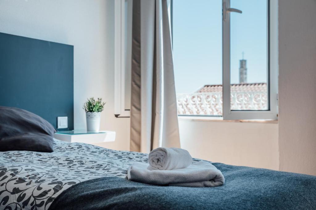Katil atau katil-katil dalam bilik di SwissPorto Guest House