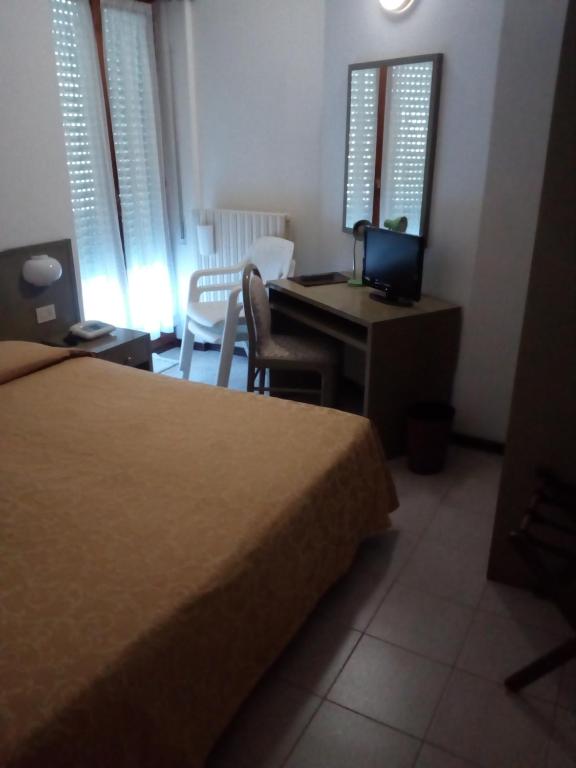 Postel nebo postele na pokoji v ubytování Hotel Torre