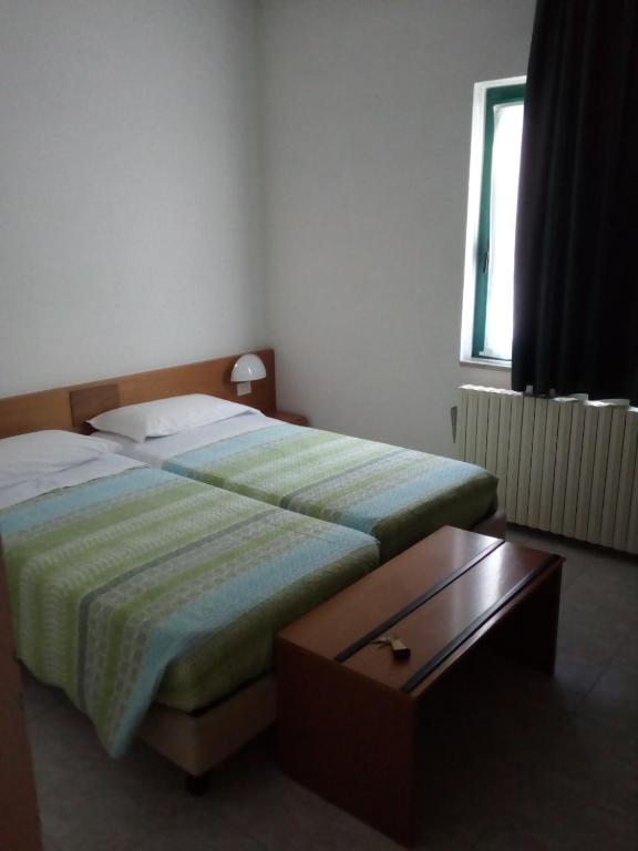 Postel nebo postele na pokoji v ubytování Hotel Torre
