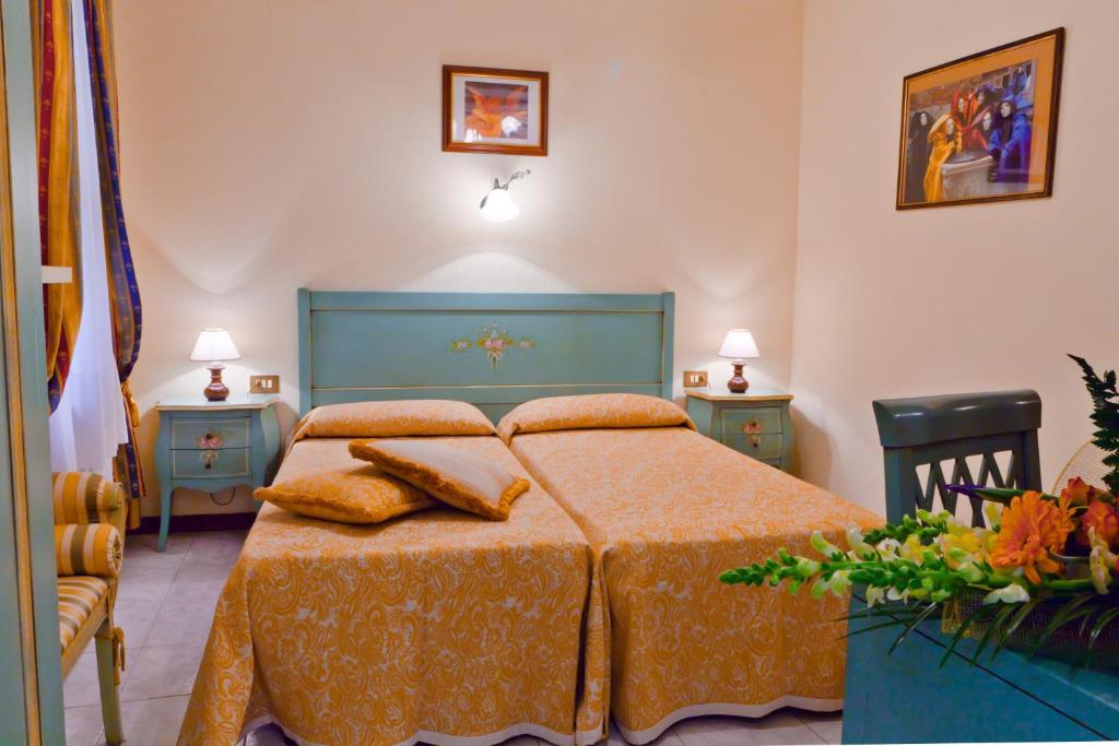 Postel nebo postele na pokoji v ubytování Hotel Henry