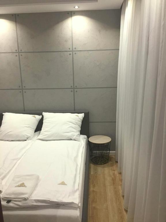 Posteľ alebo postele v izbe v ubytovaní JAB Apartments Panoramika Business & Family
