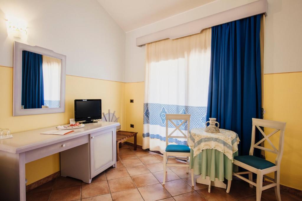 TV a/nebo společenská místnost v ubytování Hotel Luci Del Faro