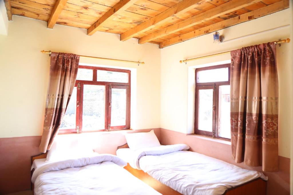 A bed or beds in a room at Himalayan Paradise