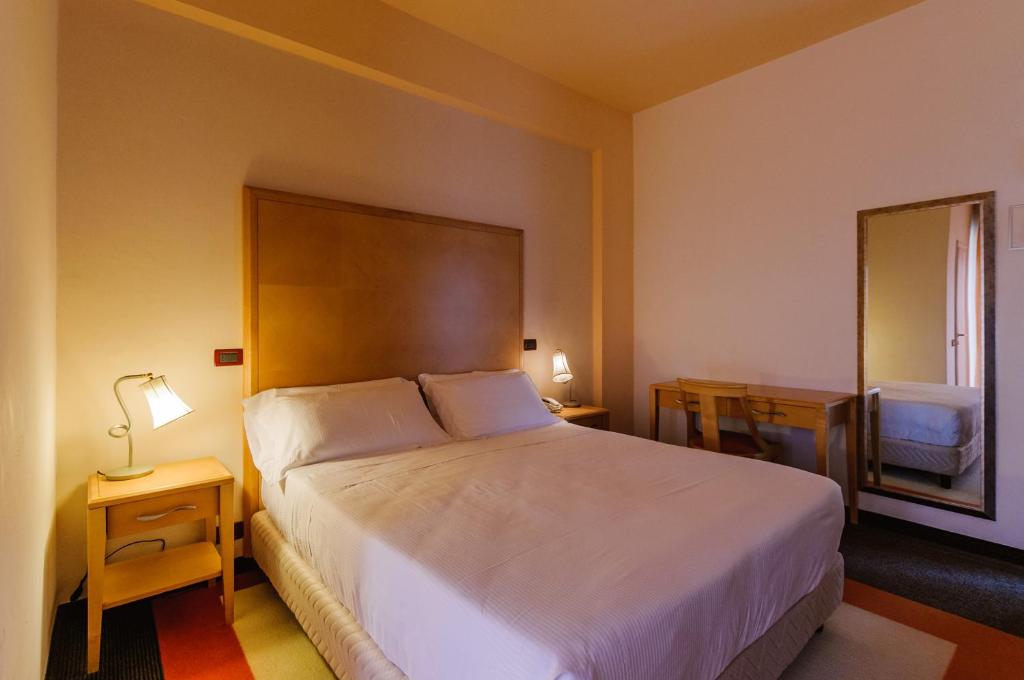 Postel nebo postele na pokoji v ubytování Park Hotel Serena