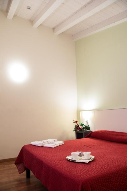 Postel nebo postele na pokoji v ubytování Hotel Motel Giglio