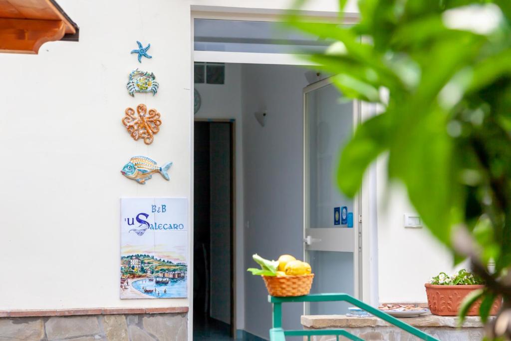 a door to a building with a basket of fruit at 'U Salecaro in Agropoli