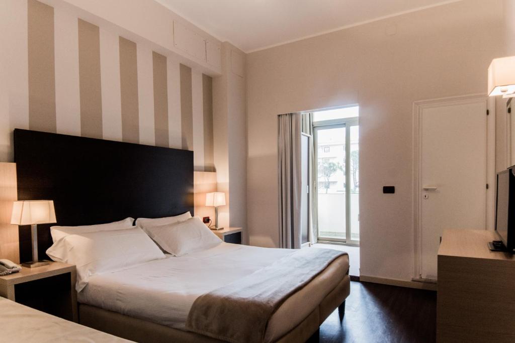 Postel nebo postele na pokoji v ubytování Park Hotel Serena