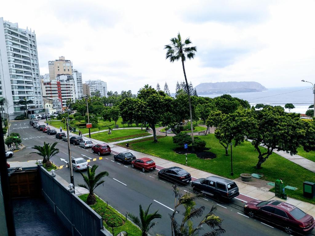 a view of a city street with cars parked at Miraflores Frente al Mar in Lima
