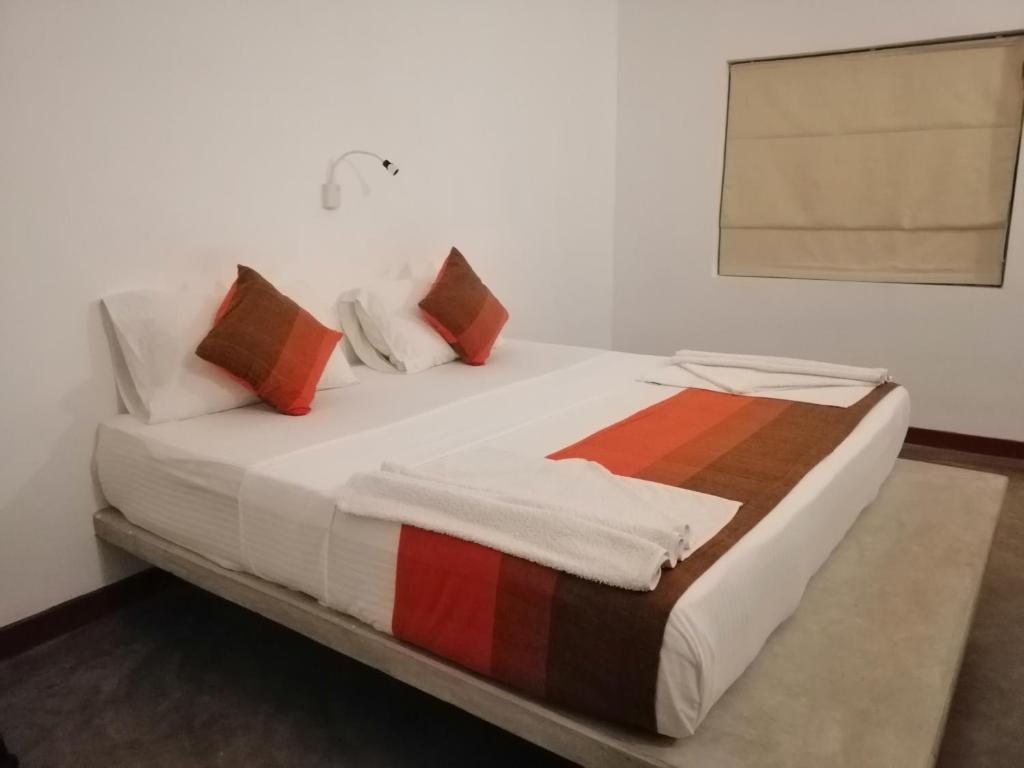 Postel nebo postele na pokoji v ubytování Kutumbaya