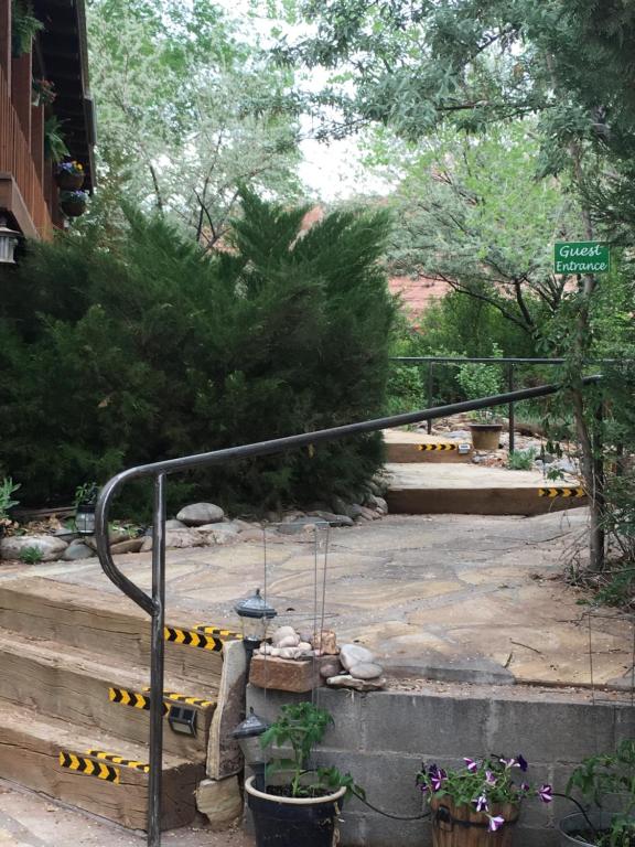 a set of stairs in a park with a sign at The Canyon Wren in Bluff