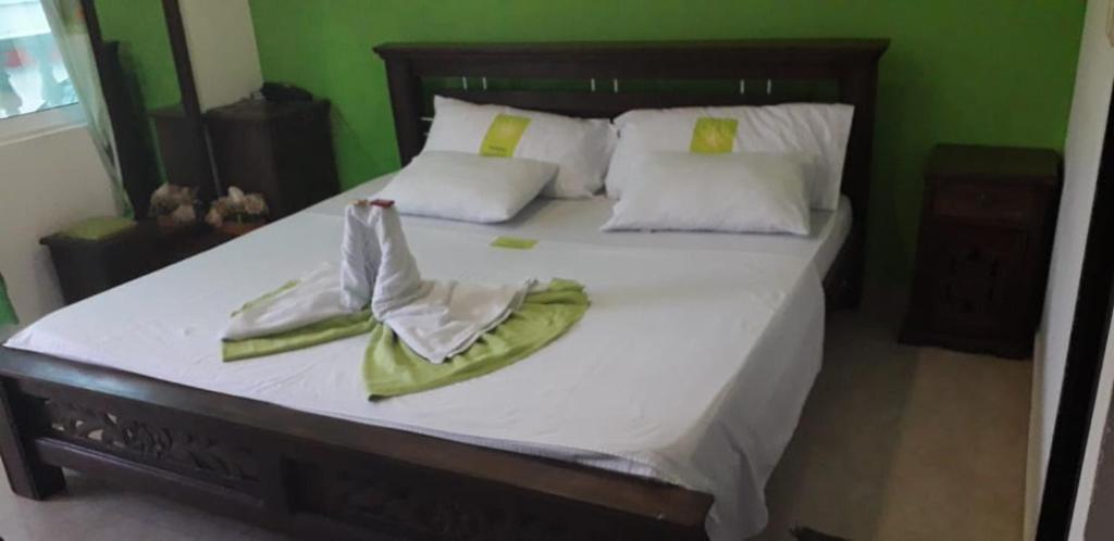 Postel nebo postele na pokoji v ubytování Hotel Mansión del Cesar