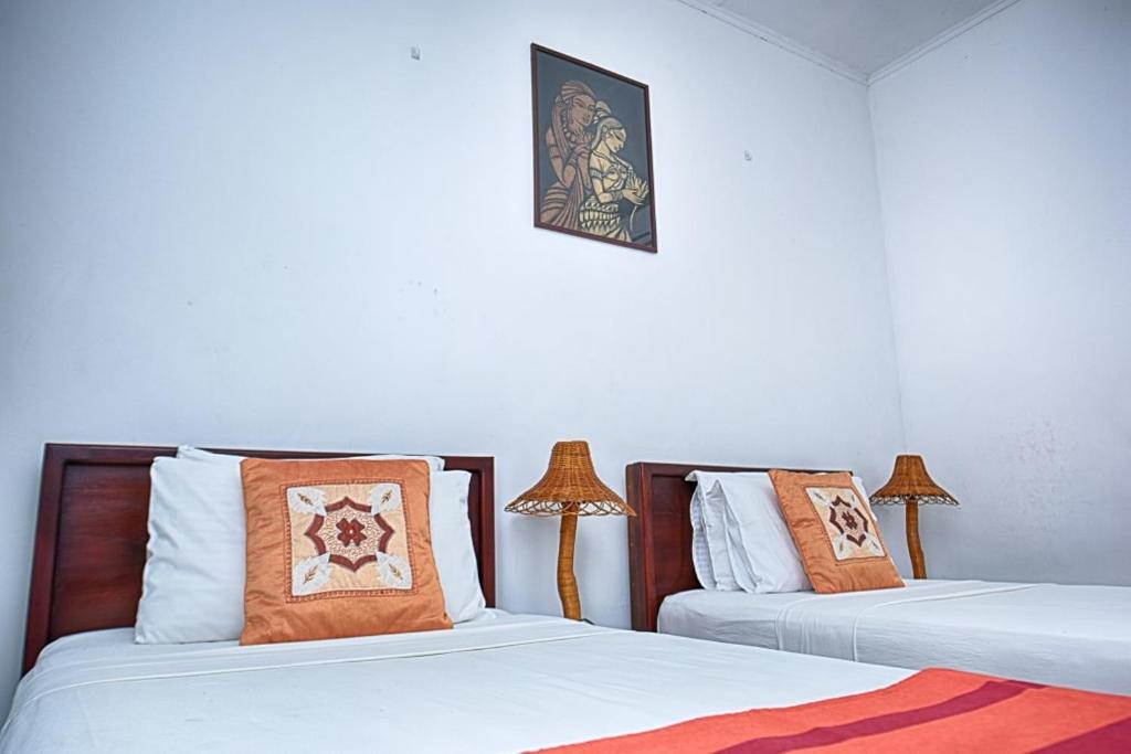 Postel nebo postele na pokoji v ubytování Jays Holiday Resort