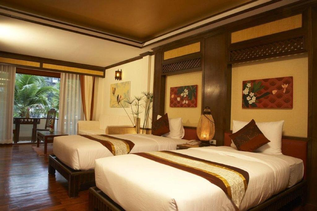 Ein Bett oder Betten in einem Zimmer der Unterkunft Salad Buri Resort- SHA Extra Plus