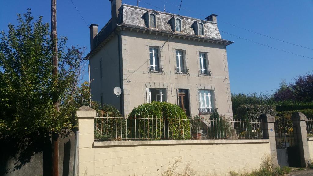 a building with a fence in front of it at La Martinelle in Maurs