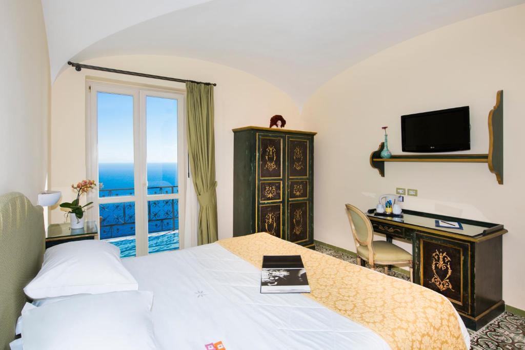Postel nebo postele na pokoji v ubytování Hotel Margherita
