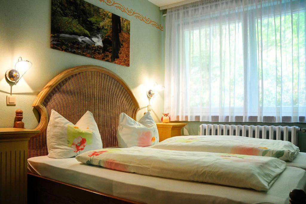 Postel nebo postele na pokoji v ubytování Pension Am Nationalpark