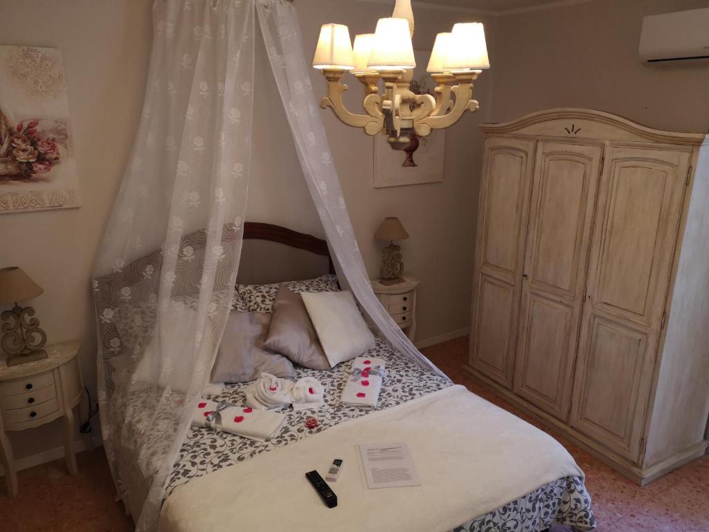 Łóżko lub łóżka w pokoju w obiekcie Vacanze Romantiche a Modica