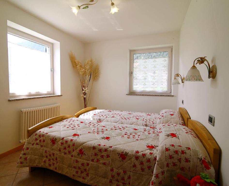 Postel nebo postele na pokoji v ubytování Paradise Apartments Paganella