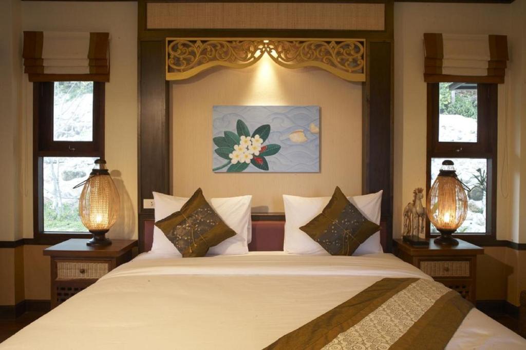 Ein Bett oder Betten in einem Zimmer der Unterkunft Salad Buri Resort- SHA Extra Plus