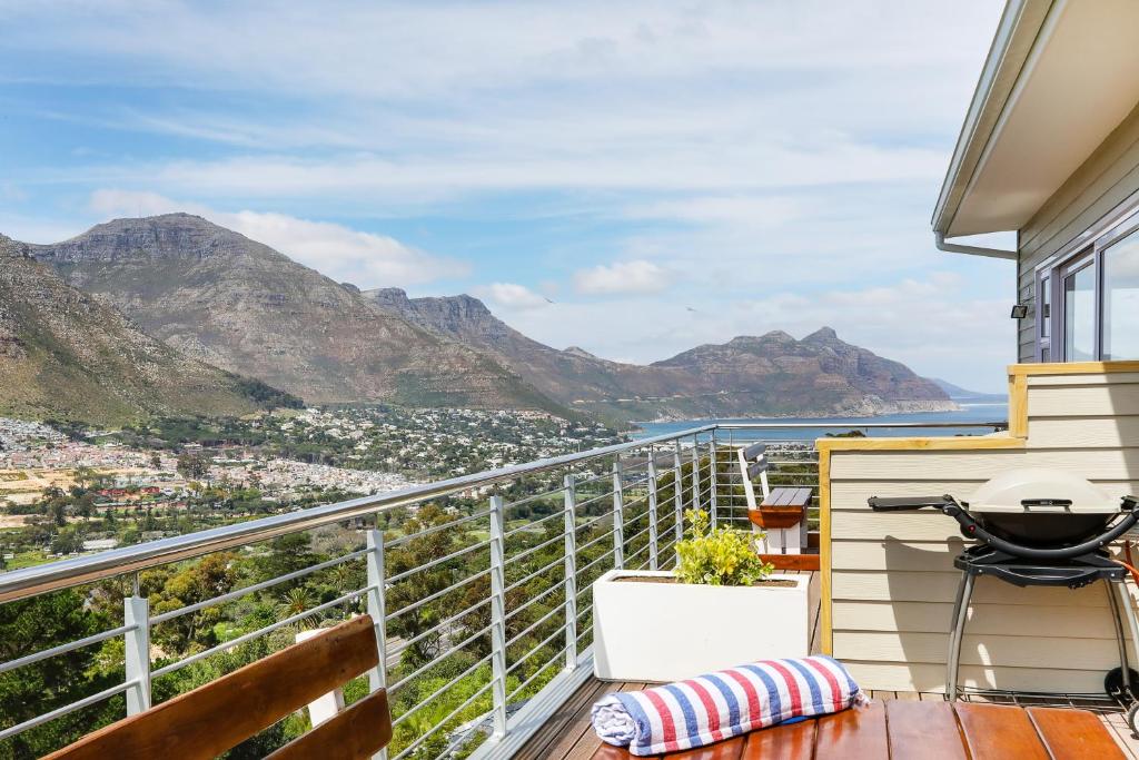 a balcony with a view of the mountains at Mount Bay in Hout Bay