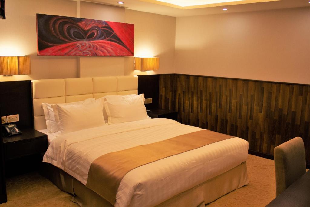 Postel nebo postele na pokoji v ubytování The Secure Inn Hotel Muscat