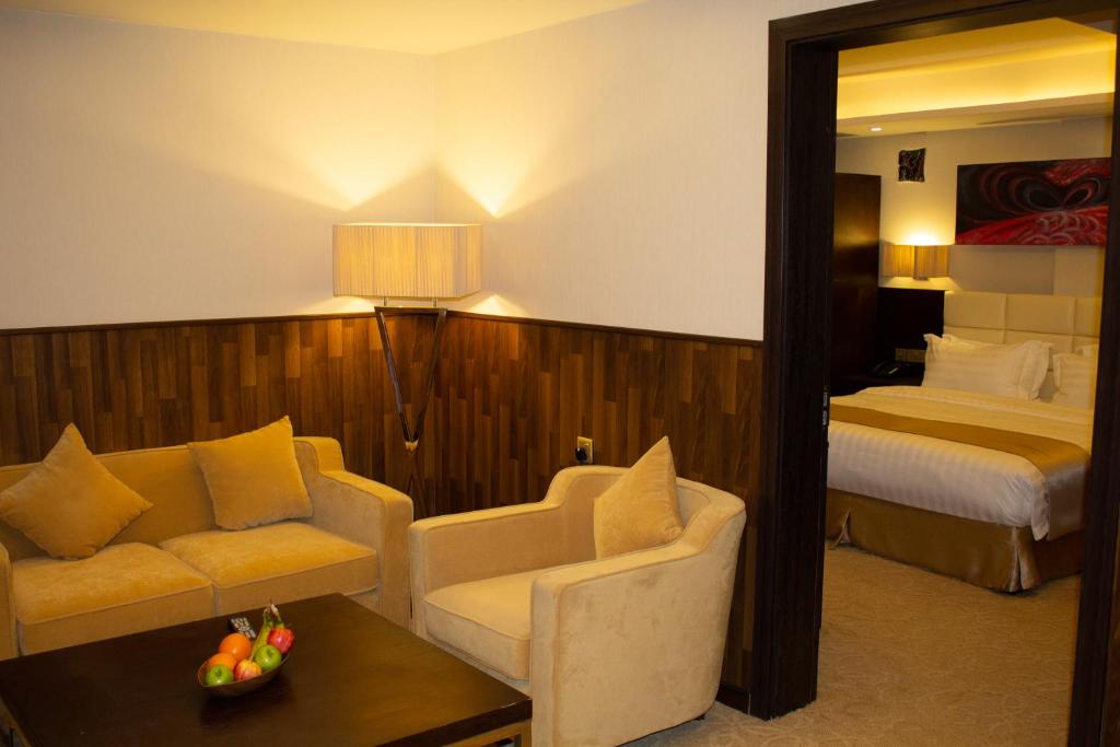Postel nebo postele na pokoji v ubytování The Secure Inn Hotel Muscat