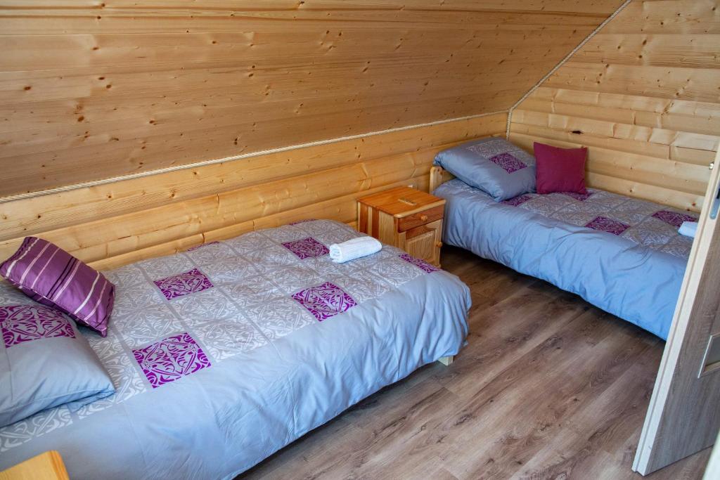 Postel nebo postele na pokoji v ubytování Domki na Beskidzie 1861