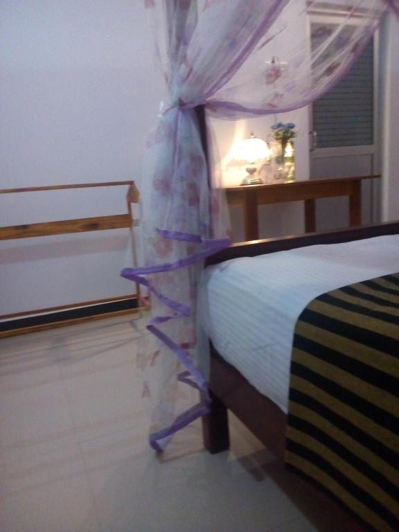 Postel nebo postele na pokoji v ubytování Peacock Villa Resort