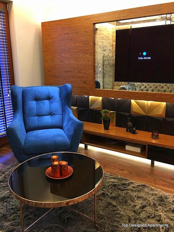 Televízia a/alebo spoločenská miestnosť v ubytovaní Top Designed Apartments