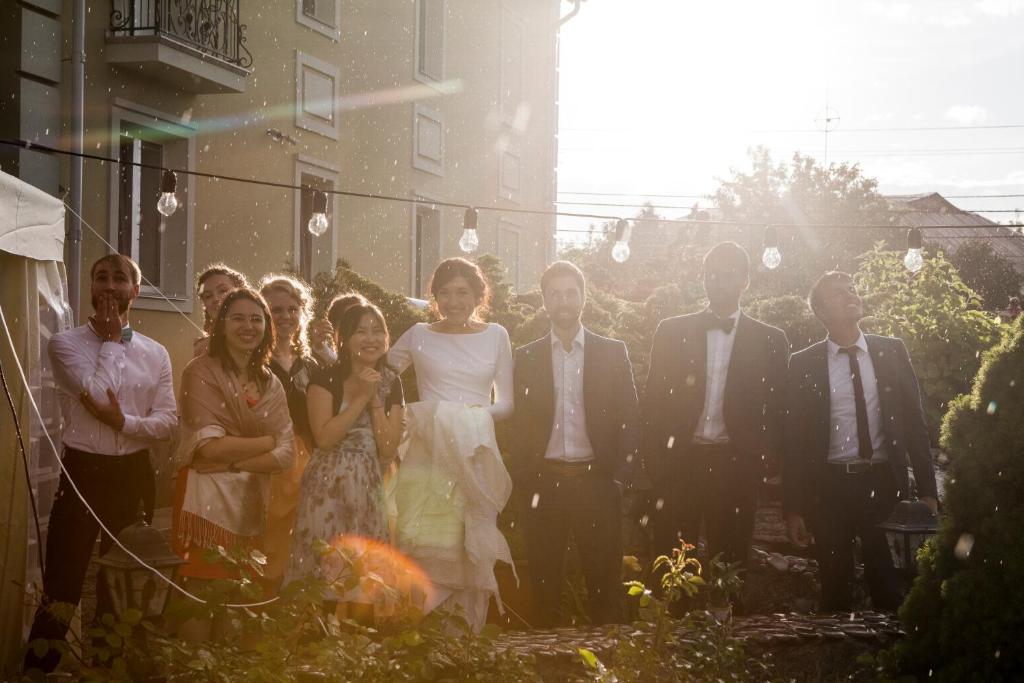 a group of people posing for a picture at a wedding at Villa Oselya in Kyiv