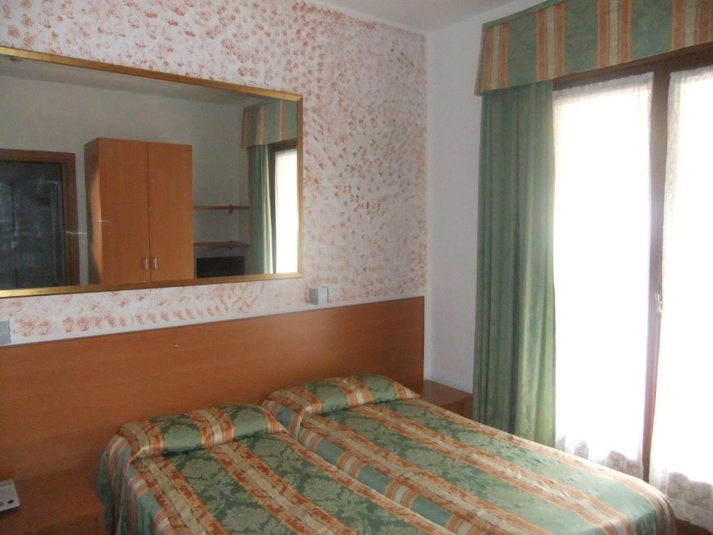 Postel nebo postele na pokoji v ubytování Hotel Da Bepi
