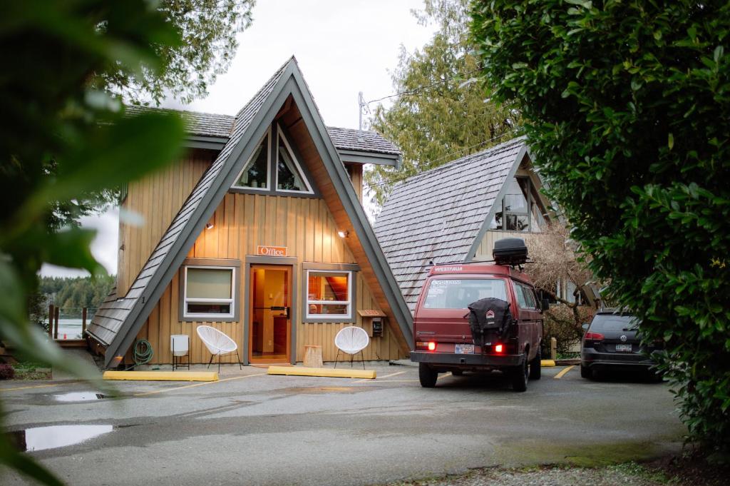a red van parked in front of a house at The Shoreline Tofino in Tofino