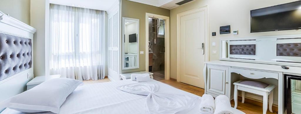 Postel nebo postele na pokoji v ubytování Hotel Adriatik 2
