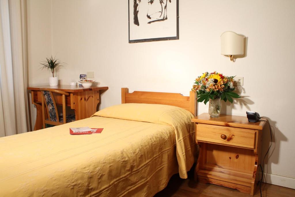 Postel nebo postele na pokoji v ubytování Hotel La Pace