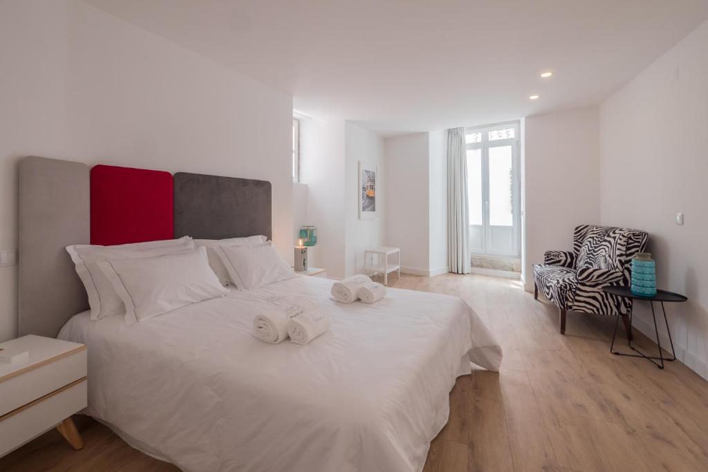Postel nebo postele na pokoji v ubytování Santo António House - Exclusive Apartment