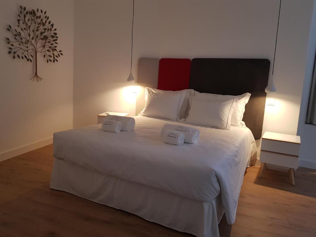 Postel nebo postele na pokoji v ubytování Santo António House - Exclusive Apartment