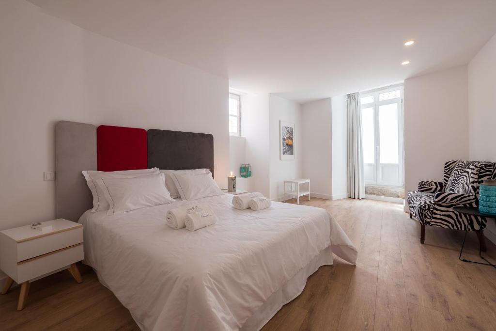 Postel nebo postele na pokoji v ubytování Santo António House - Exclusive Apartment