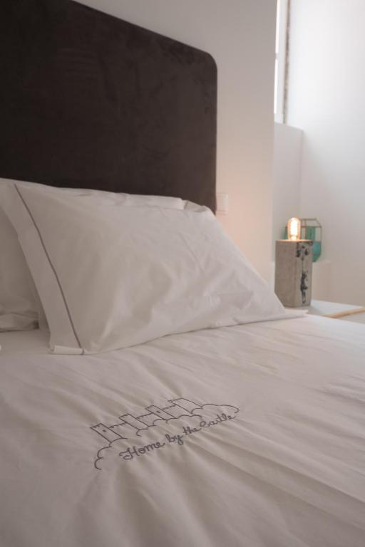 Postel nebo postele na pokoji v ubytování Santo António House - Exclusive Apartment