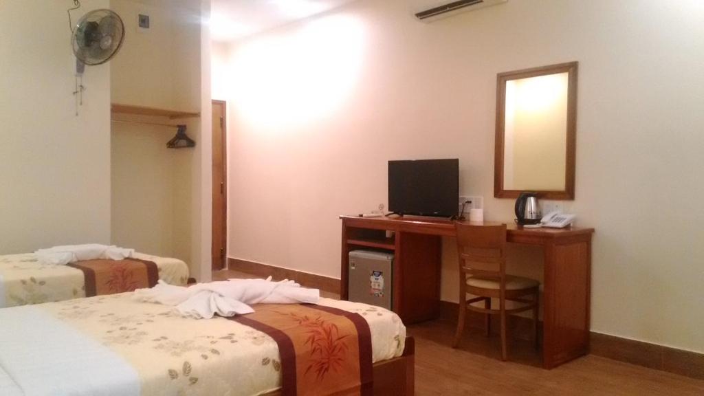 Postel nebo postele na pokoji v ubytování Tabii hotel