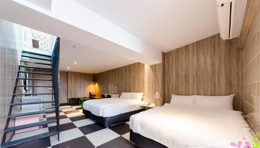 Postel nebo postele na pokoji v ubytování P&E Hotel