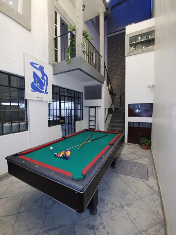 a pool table in the middle of a room at Cayalito Apart Hotel in Guatemala