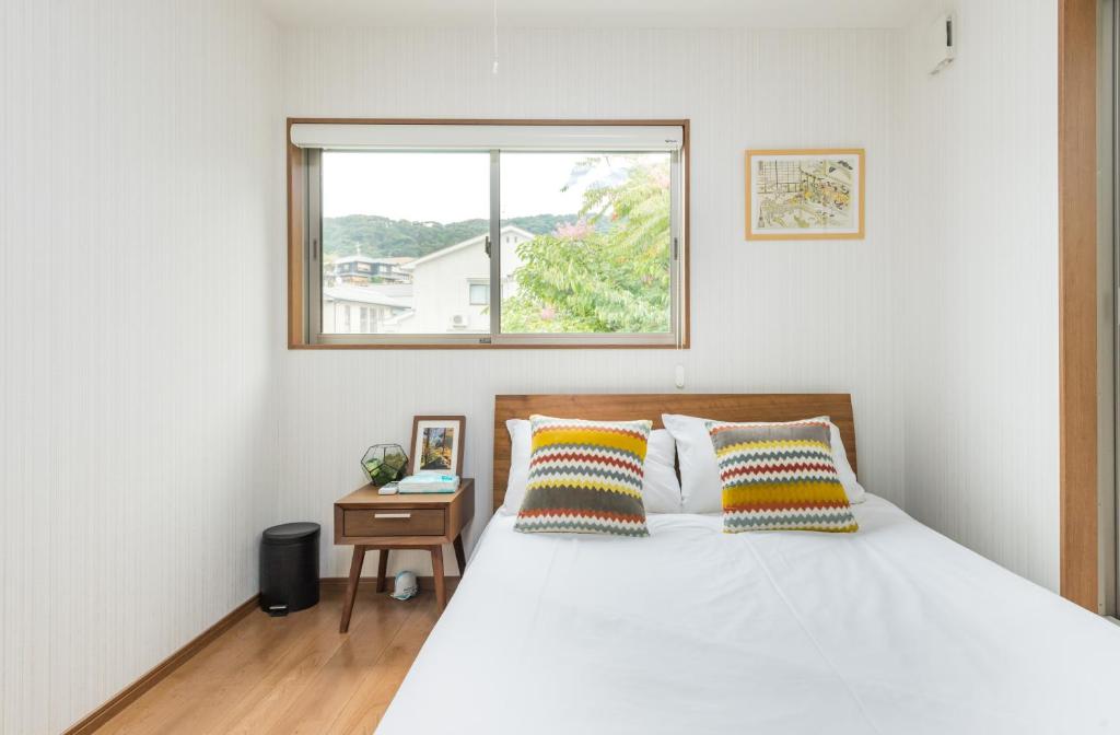 Ein Bett oder Betten in einem Zimmer der Unterkunft Yuenshe Kiyomizu Villa