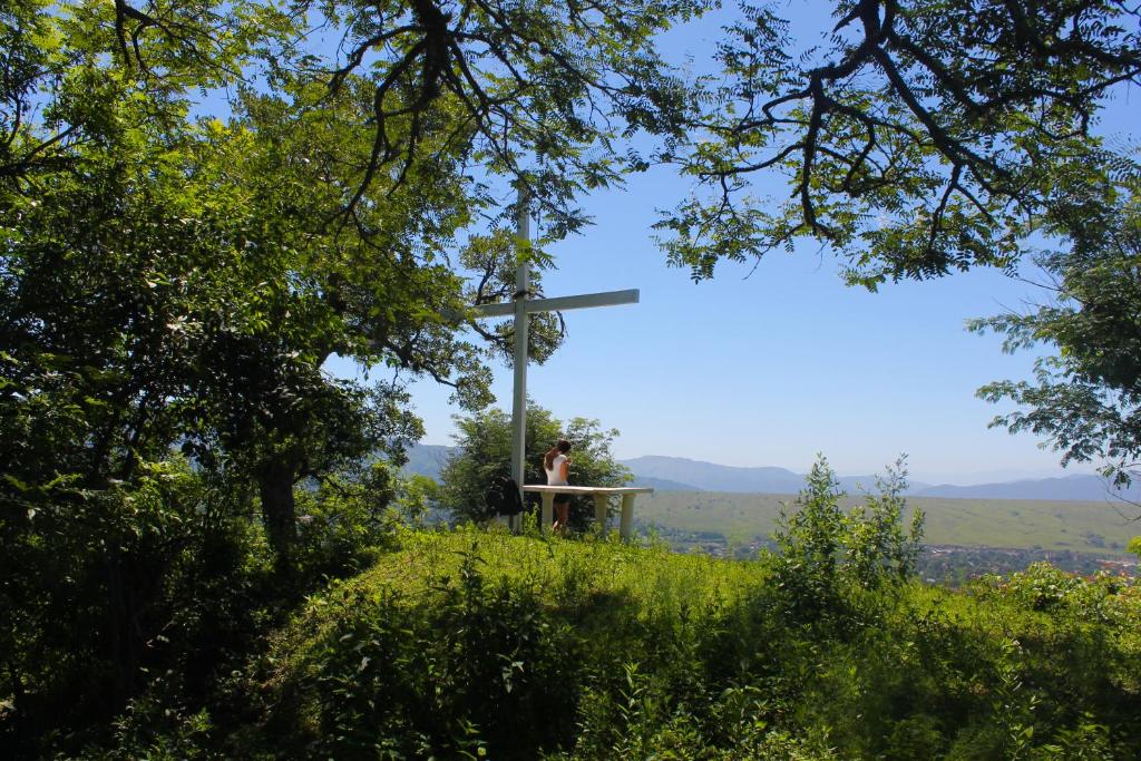 a person sitting on a table on top of a hill at San Lorenzo ByB in San Lorenzo