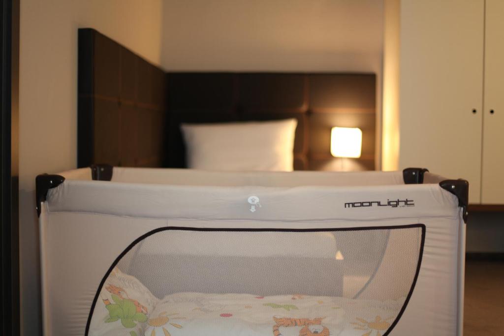 Postel nebo postele na pokoji v ubytování Hotel Kunstmühle