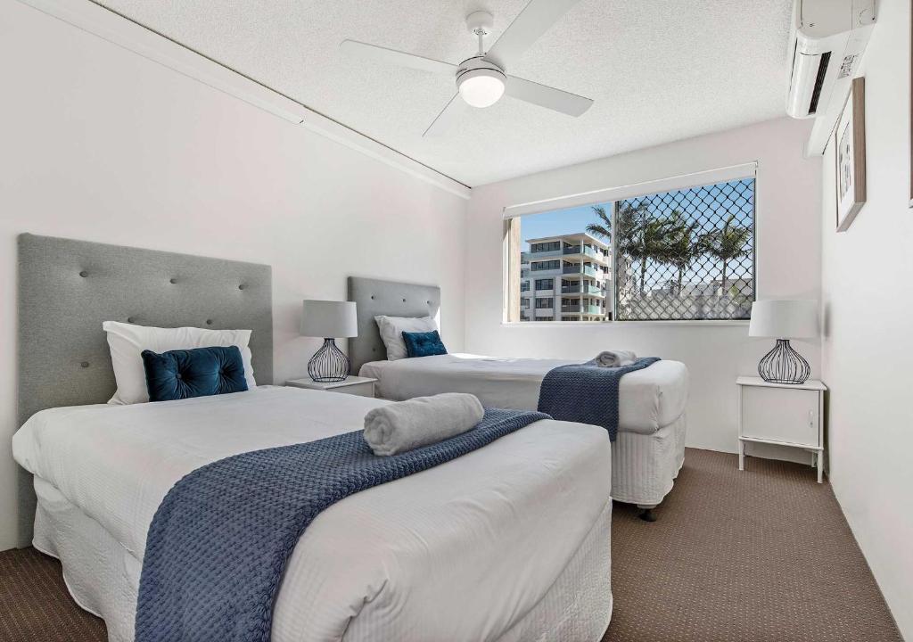 Postel nebo postele na pokoji v ubytování Sailport Mooloolaba Apartments