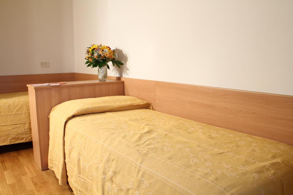 Postel nebo postele na pokoji v ubytování Hotel La Pace