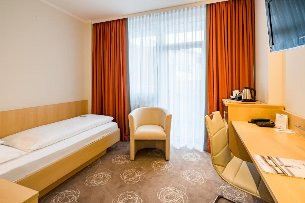 Postel nebo postele na pokoji v ubytování Best Western City Hotel Braunschweig