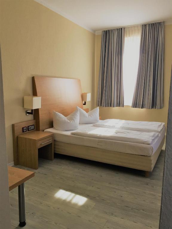 Postel nebo postele na pokoji v ubytování Pension Am Pollingpark