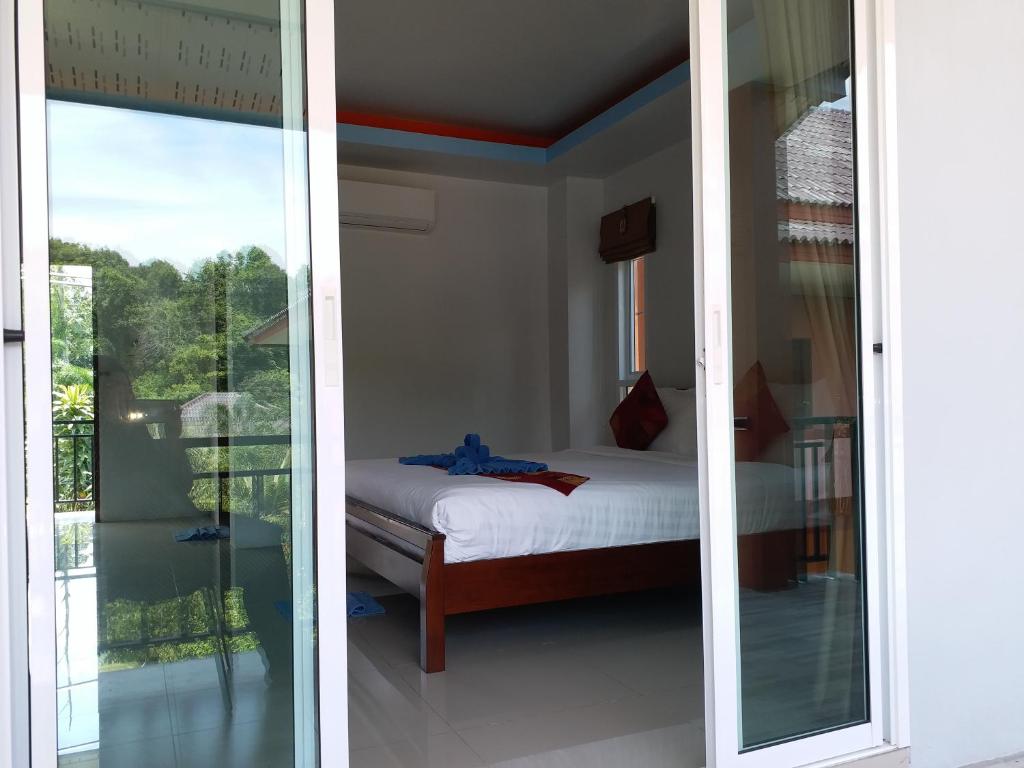 Postel nebo postele na pokoji v ubytování Tamarind Lanta Resort